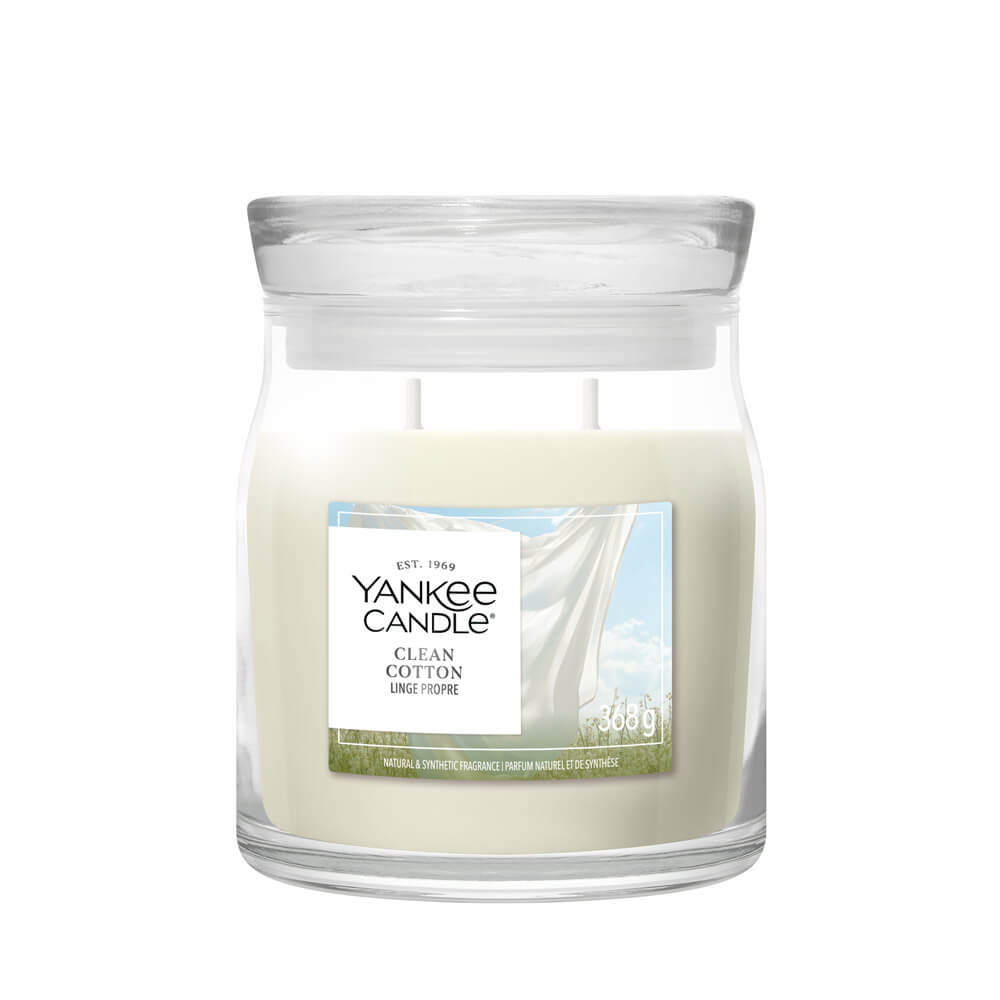 Yankee Candle Clean Cotton candle in a clear glass jar on a white background
